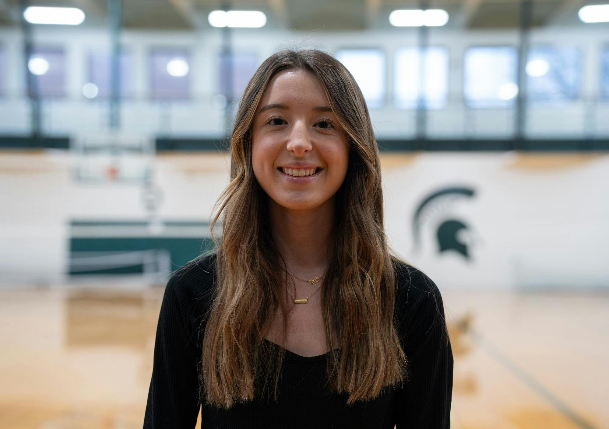 Kinesiology freshman and IM referee Julia Kelleher poses for a photo in IM East’s gym on Dec. 11, 2023. 