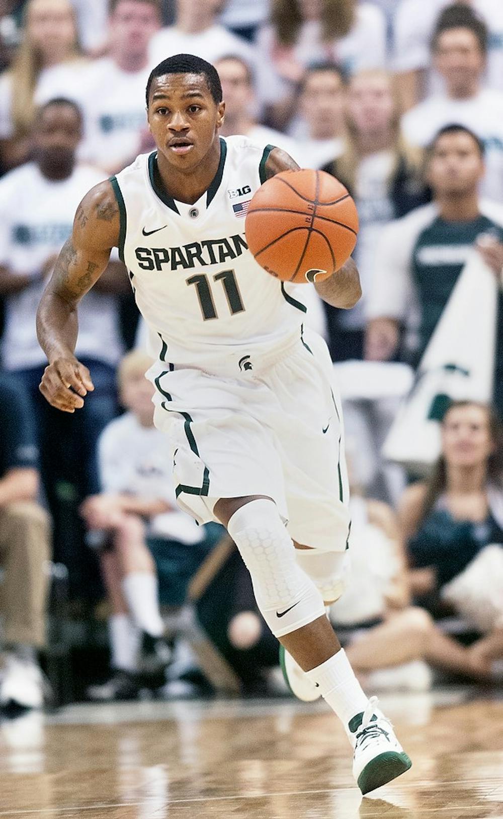 	<p>Junior guard Keith Appling dribbles the ball down the court Nov. 2 at Breslin Center. In the second regular season game of the year, Appling rallied the Spartans with a game-high 19 points to upset No. 7 Kansas in the Champions Classic in Atlanta. Adam Toolin/The State News</p>