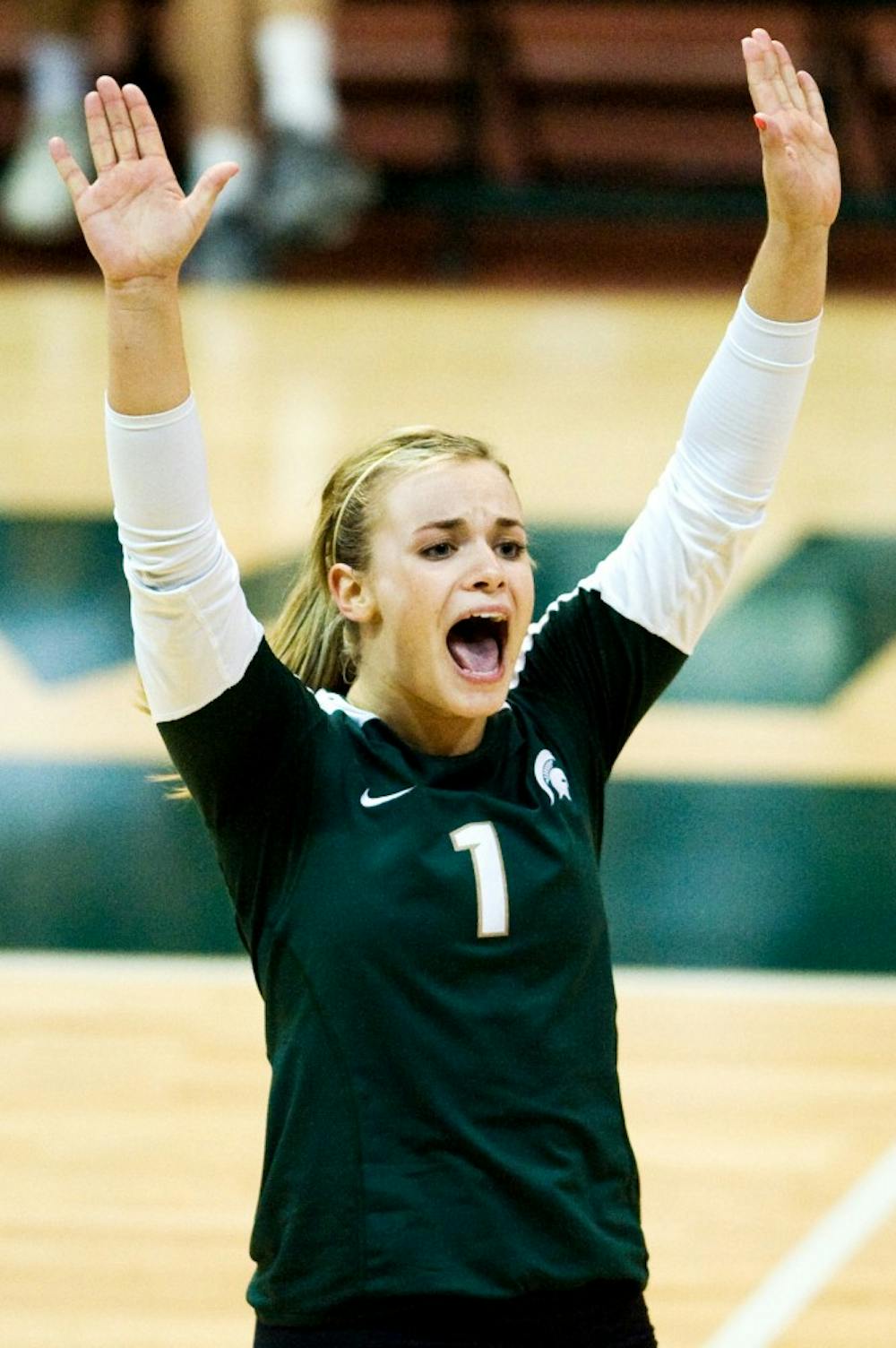 Freshman defensive specialist Kori Moster celebrates a point during Saturday's game against Minnesota at Jenison Field House. Moster posted a career-best of 24 digs. Lauren Wood/The State News