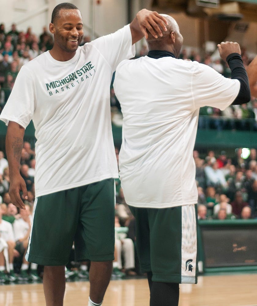	<p><span class="caps">MSU</span> Men&#8217;s basketball ex-forward Morris Peterson, left, pats teammate and ex-guard Mateen Cleaves, right, on the head after Cleaves scored during the <span class="caps">MSU</span> Basketball Alumni Game on Friday, Dec. 14, 2012, in the Jenison Field House. Cleaves and Peterson were part of the winning &#8220;Home&#8221; team, winning the game 125-118. State News File Photo </p>