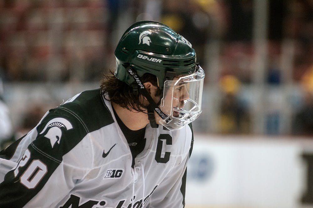 <p>Junior forward Michael Ferrantino prepares for a face off March 20, 2015, during the Big 10 Hockey Tournament at Joe Louis Arena. The Spartans lost to the Wolverines, 4-1. Allyson Telgenhof/The State News.</p>