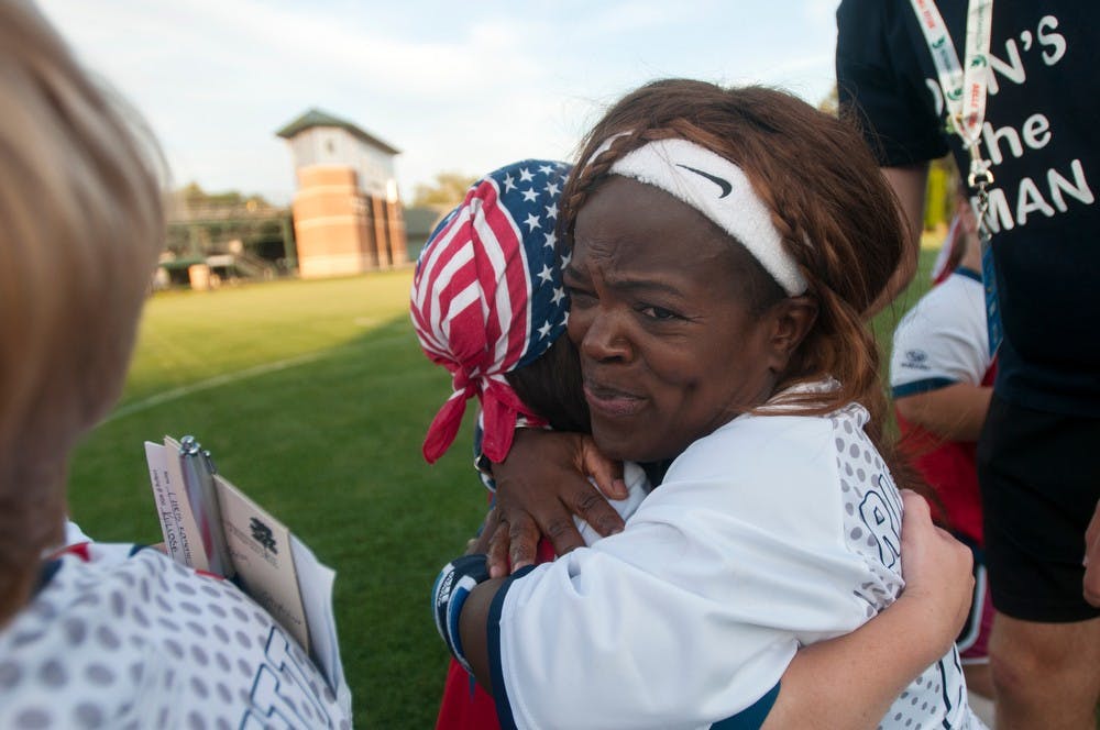 	<p>London, England, resident Mary Russell gives a hug August 8, 2013, during a soccer game at the World Dwarf Games at DeMartin Soccer Stadium. Weston Brooks/The State News</p>