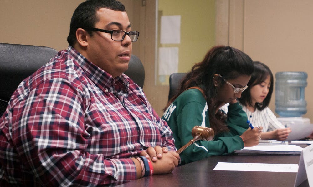 <p>Public policy senior Domonique Clemons, president of the associated students, addresses the policy committee at the ASMSU meeting on Sept. 24, 2015 in the Student Affairs and Services building. He said that he hopes to use the skills gained during his time at ASMSU to work in local or state government in Michigan.</p>
