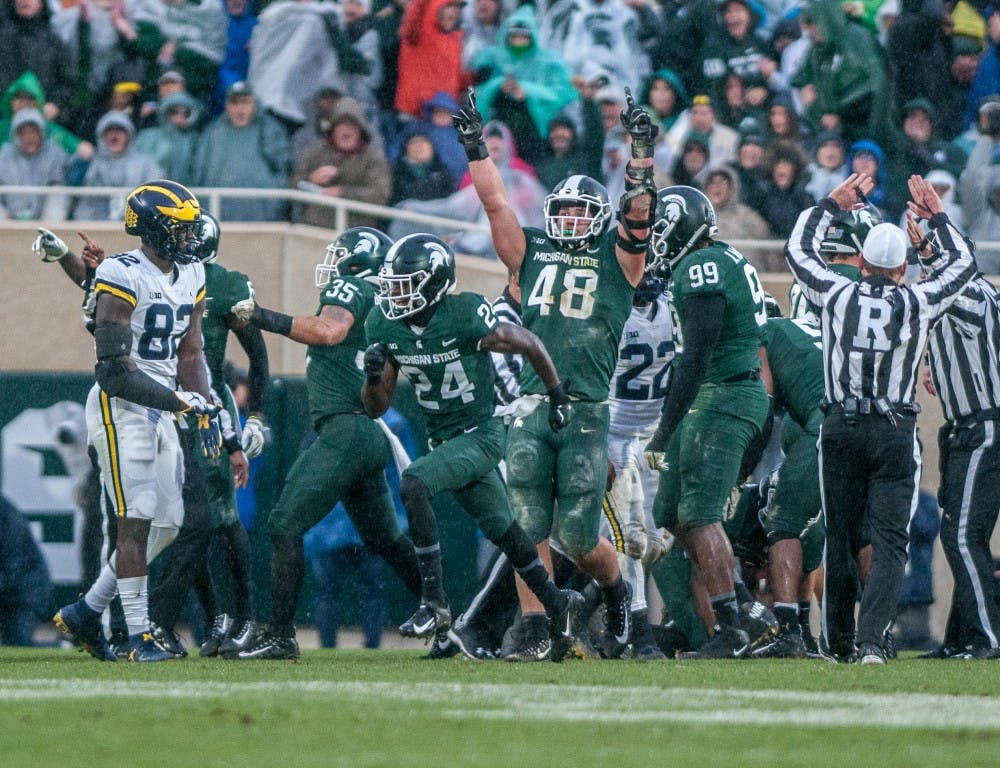 The Spartans celebrate after recovering a fumble during the game against Michigan on Oct. 20, 2018 at Spartan Stadium. The Spartans lost to the Wolverines 21-7.