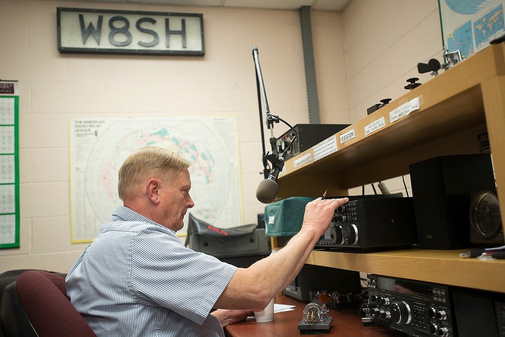 <p>W8SH radio club member Gregg Mulder listens for other stations to communicate with via Morse code March 24, 2014, at the Engineering Building. W8SH is their call sign. Julia Nagy/The State News</p>