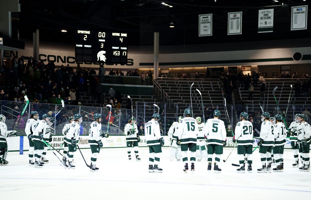 <p>Michigan Sate men&#x27;s hockey team holds their heads and sticks up high after losing their game against Notre Dame on Feb. 19, 2022. Spartans lost 4-2 against Notre Dame.</p>