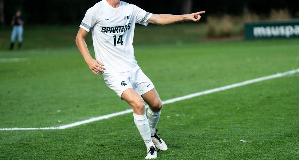<p>Defender Josh Adam points to the ball in the matchup versus Notre Dame on August 29th, 2022.</p>
