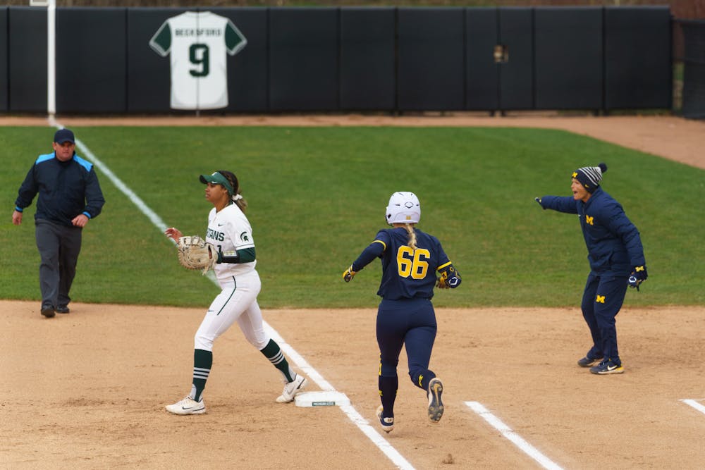 <p>Michigan freshman Annabelle Widra (66) makes it safely to first in the second inning. Michigan State lost 3-0 to Michigan at the Secchia Stadium, on April 19, 2022.</p>