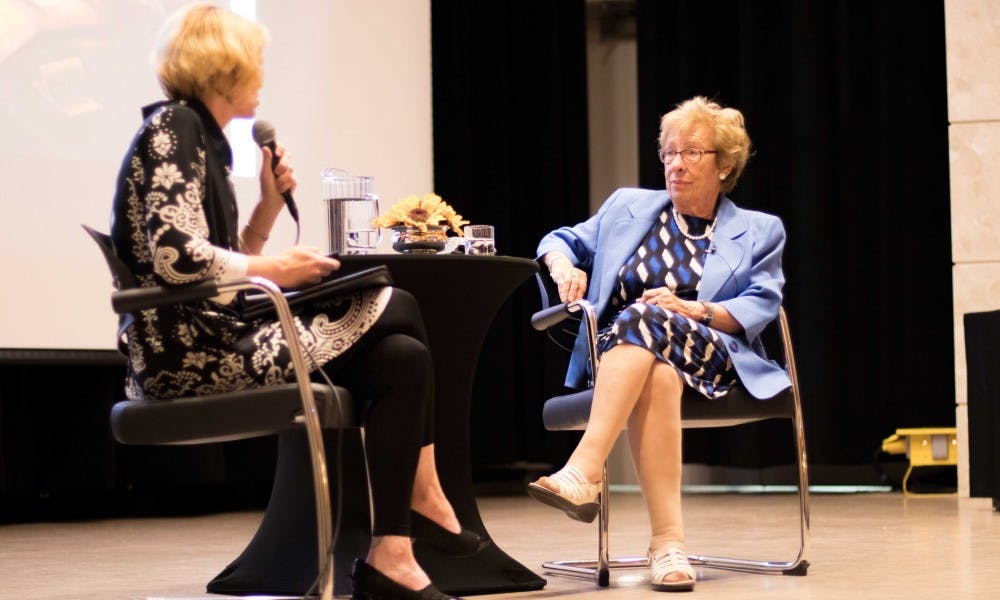 <p>Holocaust survivor and Anne Frank's step-sister Eva Schloss, right, speaks to the crowd with guest Tami Weiss, left, who is a professor of art at the University of Wisconsin, on Sept. 6 at the Kellogg Hotel and Conference Center. After speaking, Schloss answered questions from the audience, as well.</p>