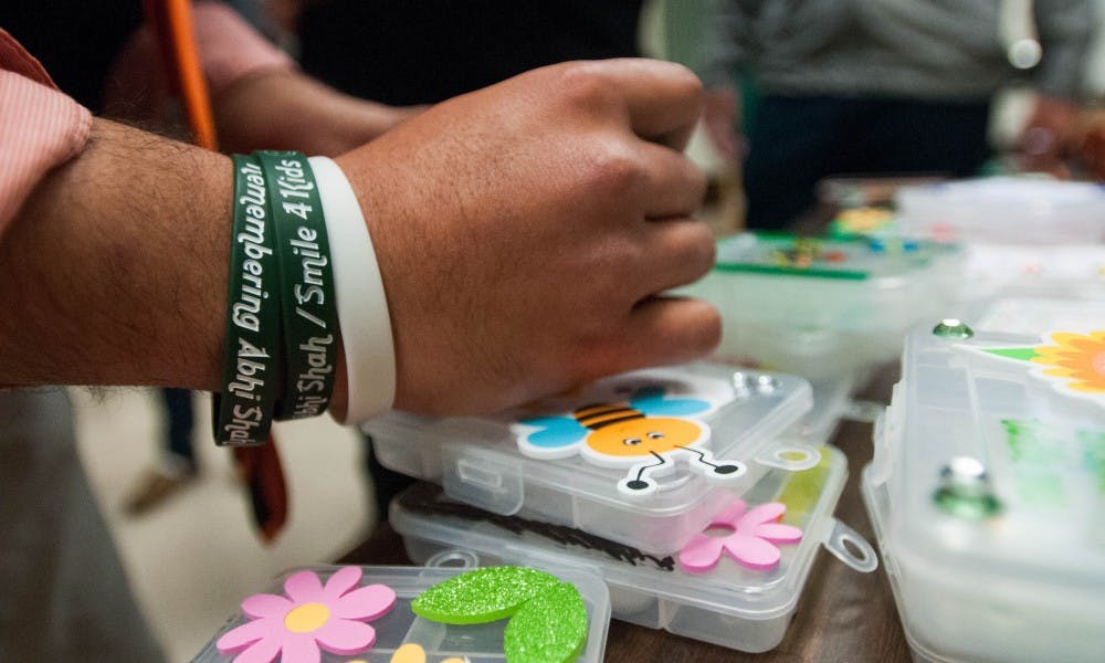 A remembrance bracelet for Abhi Shah is pictured during the Smile 4 Kids meeting on Oct. 11, 2017 at Natural Science. The Smile 4 Kids club will focus on having events to fundraise for kids and tutoring.