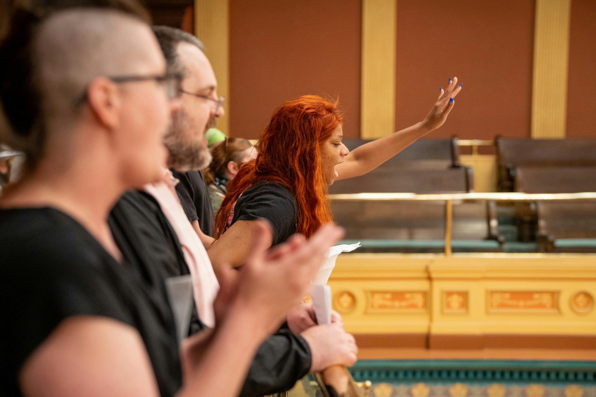 Zora Monico yells down at Michigan's House of Representatives. A group gathered at the Michigan State Capitol on June 8, 2022 to protest a 1931 abortion ban which could go back into place if Roe v. Wade is overturned by the Supreme Court.