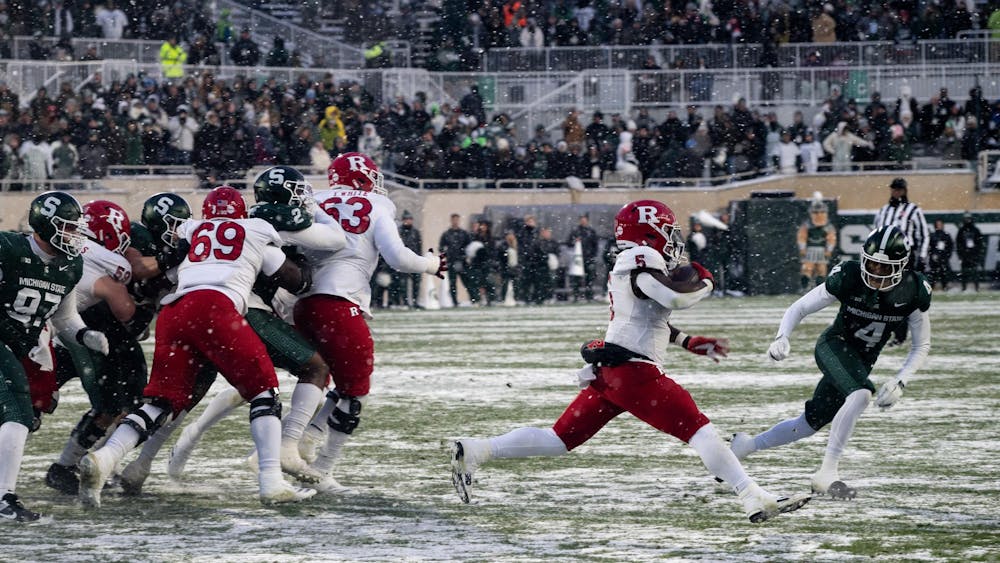 <p>MSU defensive back redshirt junior Ed Woods (4) tries to defend against Scarlet Knight running back senior Kyle Monangai (5) at Spartan Stadium on Nov. 30, 2024.</p>