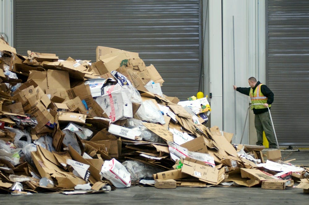 	<p>Recycling aide Joe Rahall of Lansing sweeps up debris from the main floor of the Material Recovery Facility on Monday at the Recycling Center. Sunday marked the beginning of RecycleMania, an eight—week competition among more than 600 colleges and universities.</p>