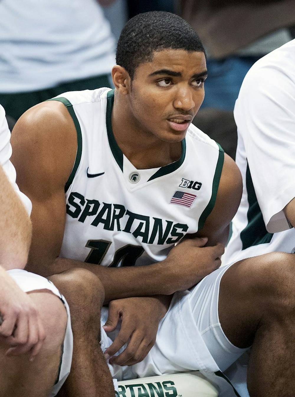 	<p>Freshman guard Gary Harris holds his arm in pain while watching from the bench Nov. 20 at Breslin Center. Harris left the game in the first half because of an injury and watched as <span class="caps">MSU</span> beat Boise State. Adam Toolin/The State News</p>