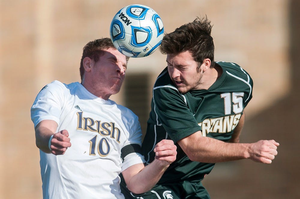 	<p>Senior forward Nick Wilson and Notre Dame midfielder Dillon Powers reach for the ball on Sunday at Alumni Stadium in South Bend, Ind. The Spartans lost to the Fighting Irish in the second round of the <span class="caps">NCAA</span> Tournament, 3-0.  Julia Nagy/The State News</p>