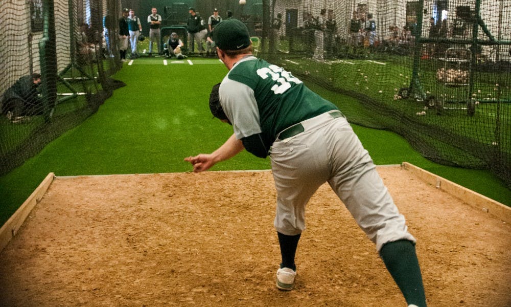 Freshman right handed pitcher Caleb Sleeman (38) pitches the ball during practice on Feb. 3, 2017 at McLane Baseball Stadium at John H. Kobs Field. The Spartans are preparing for opening day on Feb.17, 2017.