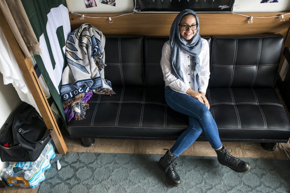 Lyman Briggs freshman Maya Al-saghir poses for a portrait in her dorm room on Feb. 1, 2016 at Holmes Hall. Al-saghir is a muslim student and second-generation immigrant who has taken a stand against President Trump's executive order on temporarily banning travel from seven Muslim-majority countries. "People will joke about like, 'oh I'm going to move to Canada,'" Al-saghir said. "And it's, funny, but really that's what we can't do. That's exactly what they want is they want us to leave and give it up. But that's like, we can't do that. We have to stay and fight. We were born here."
