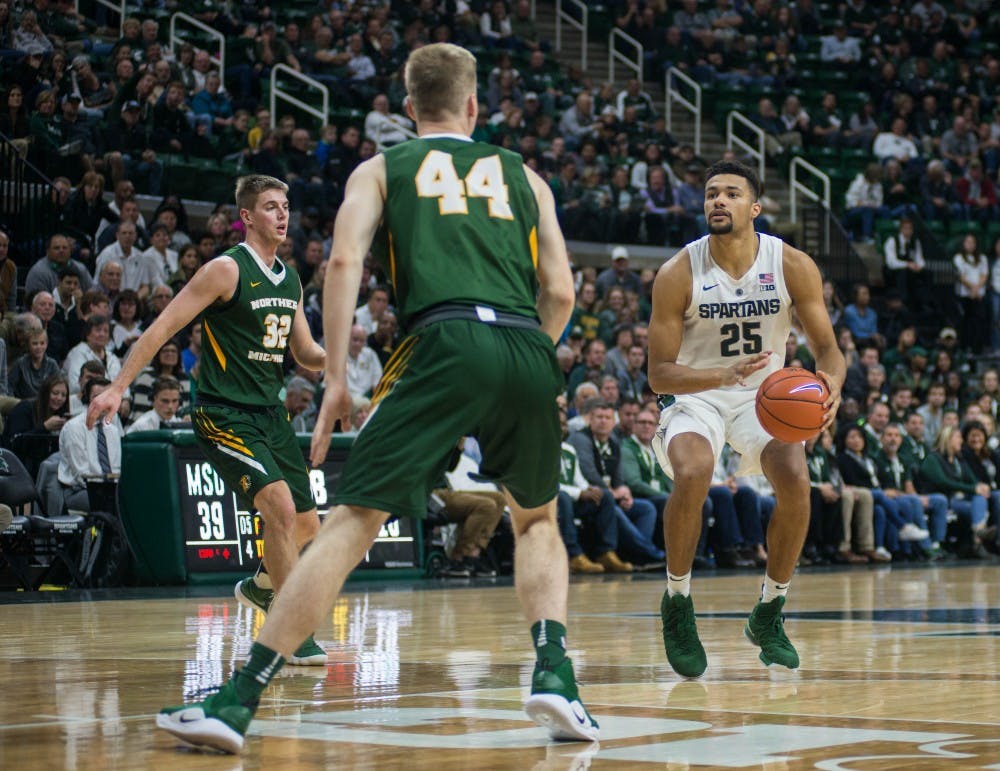 Red shirt senior forward Kenny Goins (25) prepares to take a shot during the game against Northern Michigan at Breslin Center on Oct. 30, 2018. The Spartans defeated the Wildcats, 93-47.