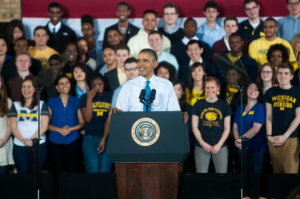 <p>President Barack Obama smiles as he gives his speech April 2, 2014, at the Intramural Sports Building at the University of Michigan in Ann Arbor. President Obama spoke to the crowd about his goal to raise the federal minimum wage to $10.10. Erin Hampton/The State News</p>