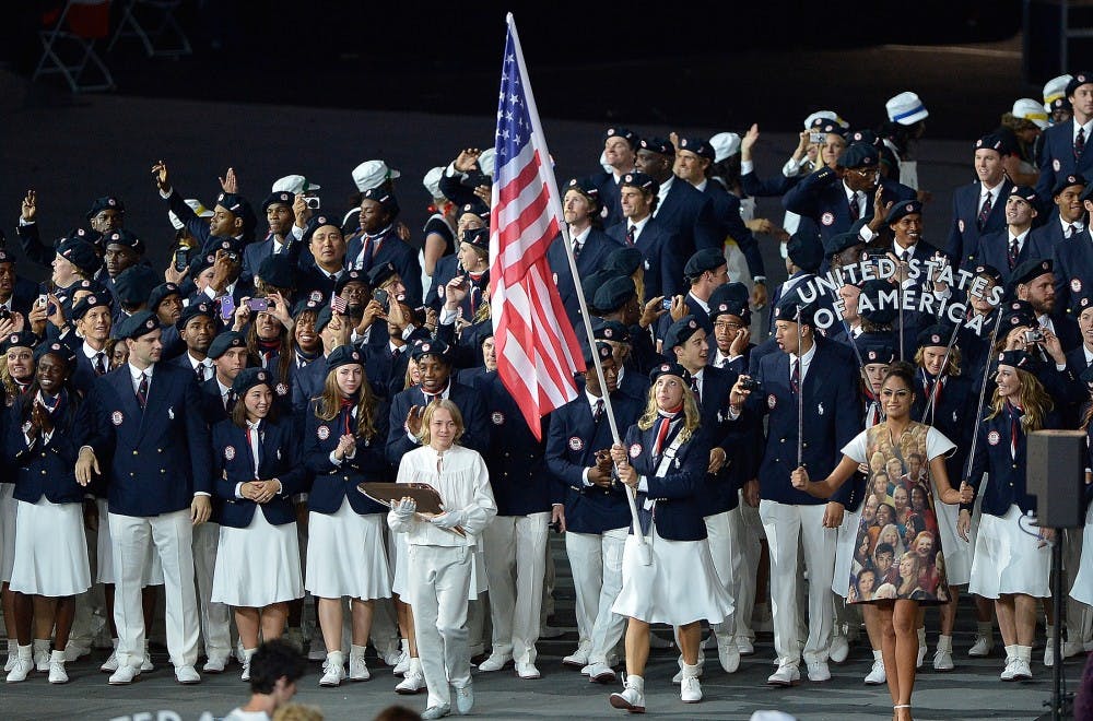 The United States Olympic team led by flag bearer and fencer Mariel Zagunis marches into the stadium during the Opening Ceremony for the London 2012 Summer Olympic Games at the Olympic Stadium in London, England, Friday, July 27, 2012. (David Eulitt/Kansas City Star/MCT)