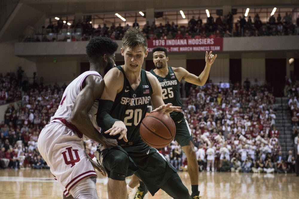 Junior guard Matt McQuaid (20) looks to get around the defender during the game against Indiana on Feb. 3, 2018 at Simon Skjodt Assembly Hall. The Spartans beat the Hoosiers 63-30 (C.J. Weiss | The State News) 