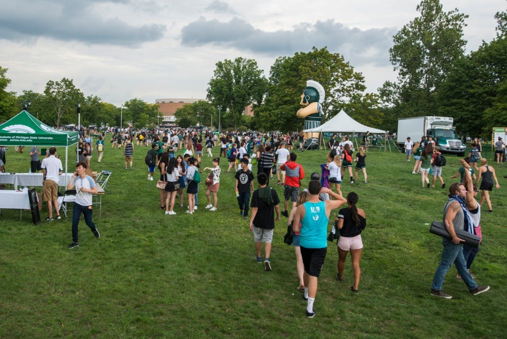 Students attending Sparticipation walk away from Cherry Lane Field on Aug. 30, 2016. Sparticipation is an annual event that provides student organizations a space to promote their organization to thousands of students. Sparticipation was cancelled rescheduled to a different date due to severe weather.