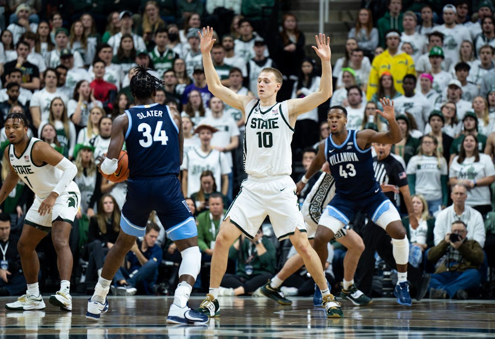 Graduate student forward Joey Hauser (10) guards opponent graduate student forward Brandon Slater (34) during a game against Villanova at the Breslin Center on Nov. 18, 2022. The Spartans defeated the Wildcats 73-71. 