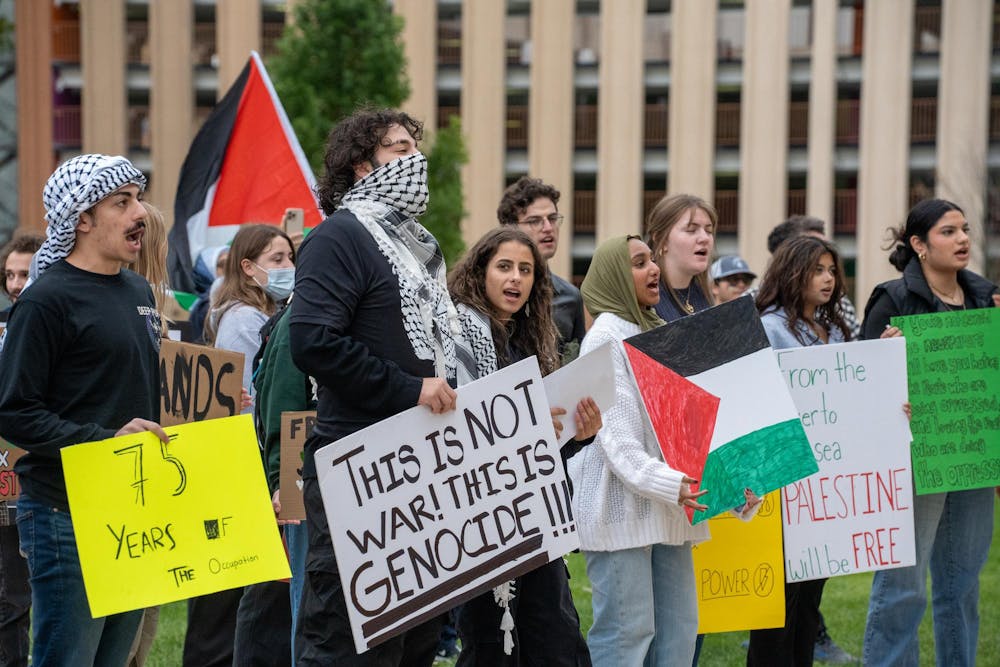 <p>Protestors held their posters during the Palestinian protest at the Lansing Capitol on Oct. 12, 2023. </p>