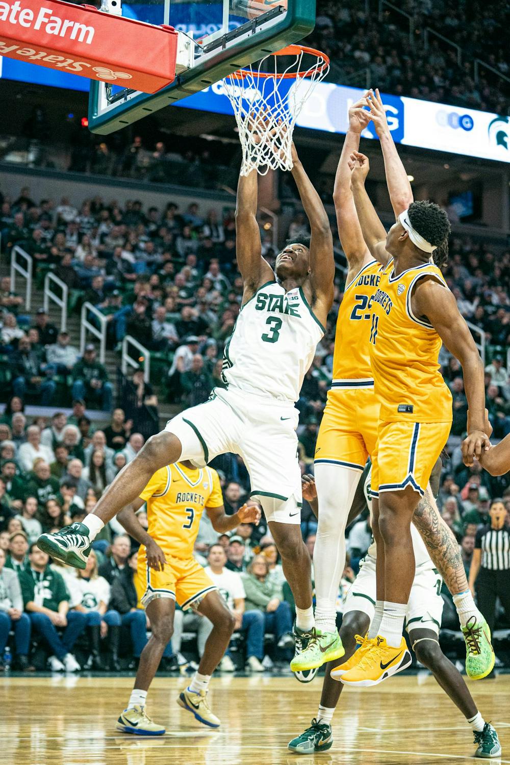 <p>MSU freshman forward, Cam Ward (3) jumps for a layup with two Toledo players following after him during the MSU versus Toledo matchup at the Breslin Center in East Lansing, Michigan on Tuesday, Dec. 16, 2025.</p>
