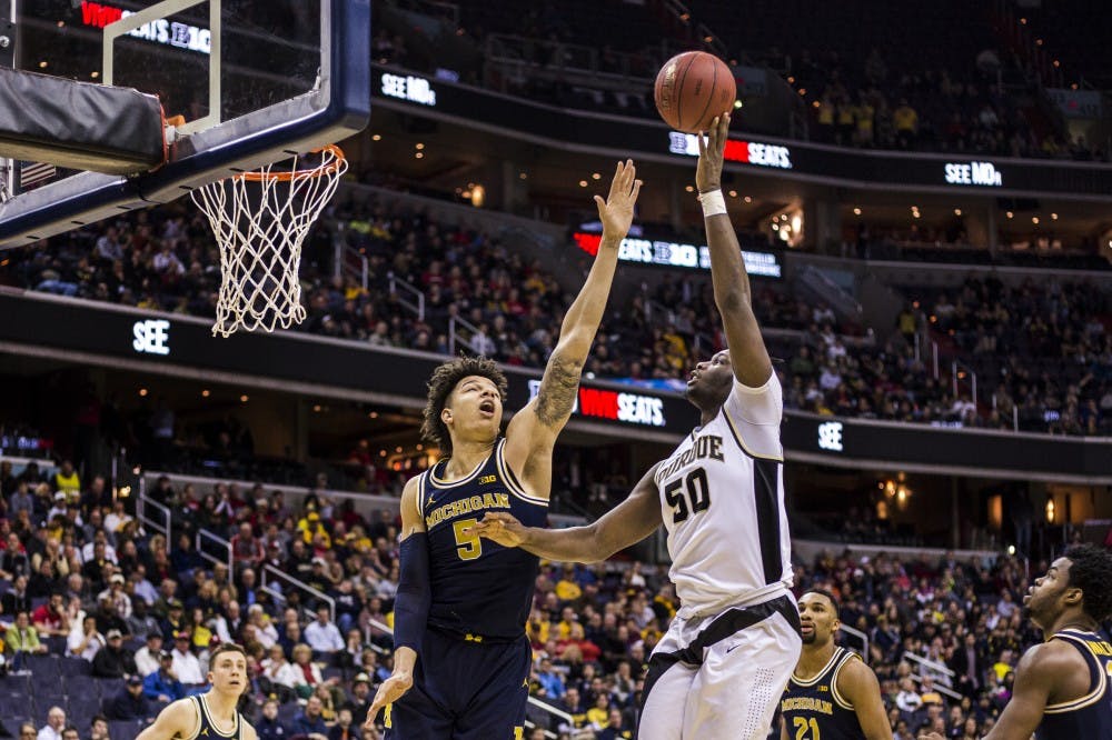 Michigan junior forward D.J. Wilson (5) blocks Purdue forward Caleb Swanigan (50) during the second half of the game in the third round of the Big Ten Tournament on March 10, 2017 at Verizon Center in Washington D.C. 