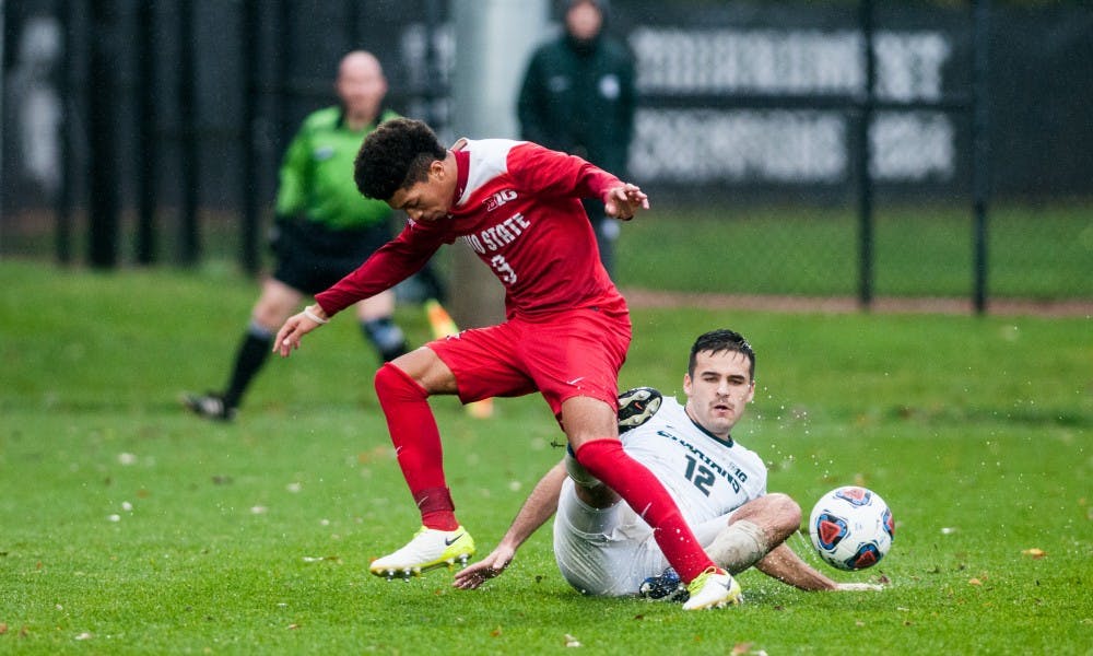 Junior defender John Freitag (12) goes after the ball during the game against Ohio State, on Nov. 5, at DeMartin Stadium. The Spartans fell to the Buckeyes, 2-1, and were eliminated from the Big Ten tourney.