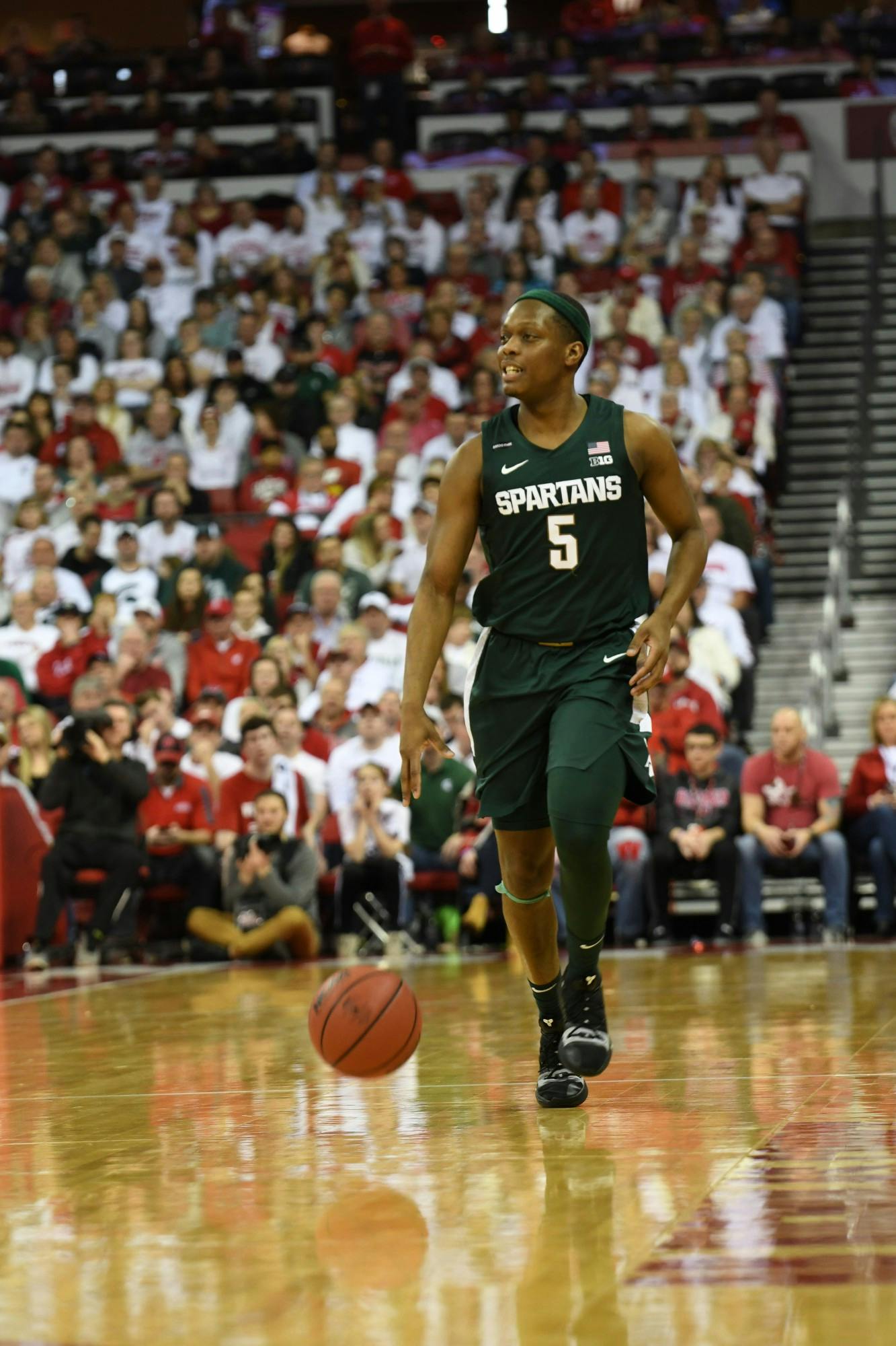 Senior guard Cassius Winston (5) dribbles down the court during the basketball game against Wisconsin at the Kohl Center in Madison, Wisconsin on February 1, 2020. The Spartans fell to the Badgers 63-64.