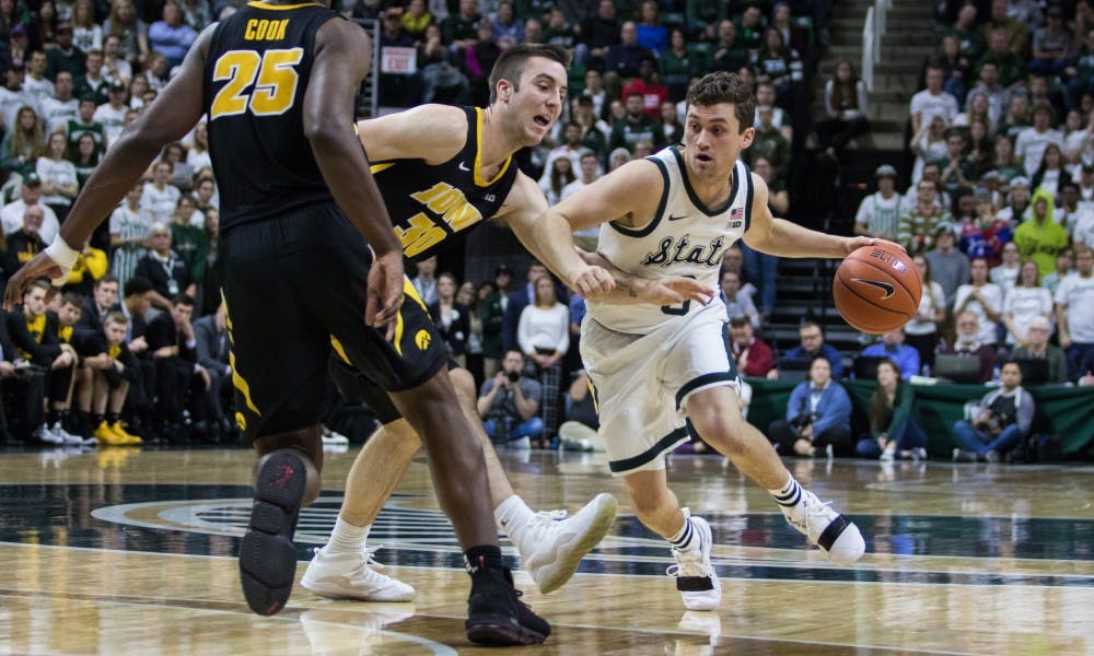 <p>Then-freshman guard Foster Loyer (3) dribbles the ball during the game against Iowa at Breslin Center on Dec. 3, 2018. The Spartans defeated the Hawkeyes, 90-68.</p>