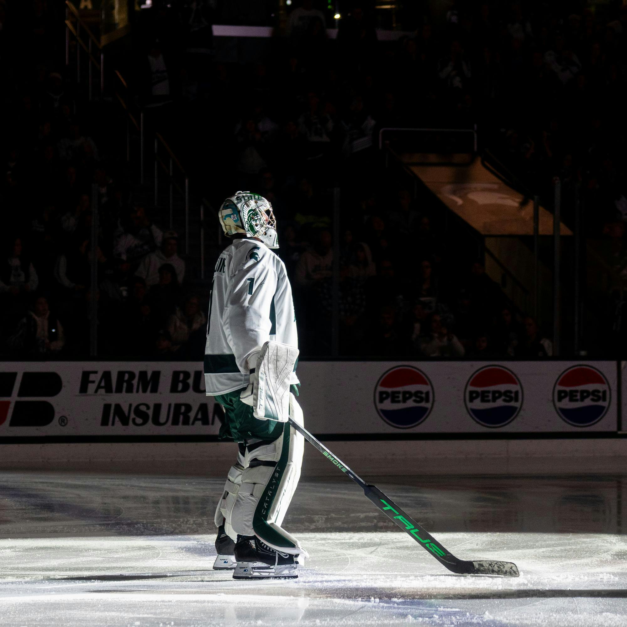 MSU Jr. G, Trey Augustine (1), stands in thw spotlight before his game in Munn Ice Arena in East Lansing, MI on Feb. 28, 2026.