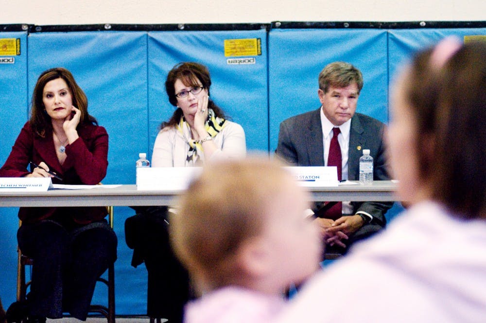 	<p>From left, state Sen. Gretchen Whitmer, D-East Lansing, East Lansing Public Schools Board of Education President Rima Addiego and East Lansing City Manager Ted Staton listen at a town hall meeting held Wednesday at Donley Elementary School, 2961 E. Lake Lansing Road. </p>