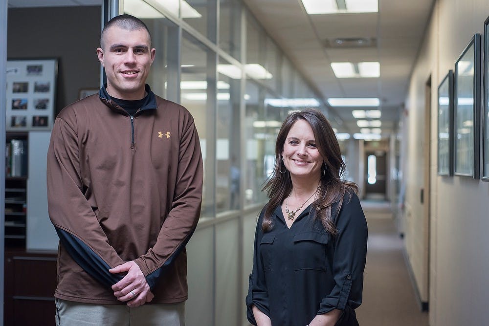 <p>Detective James Terrill and detective sergeant Andrea Beasinger, with the Special Victims Unit, pose for a photo Jan. 28, 2015, at the MSU Police Department, 1120 Red Cedar Rd. in East Lansing. The Special Victims Unit was created 4 months ago. Emily Nagle/The State News</p>