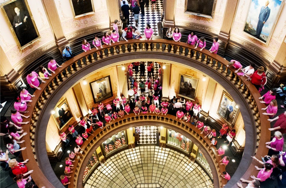 Pro-choice protestors fill the Michigan State Captiol Building rotunda on Tuesday afternoon, June 12, 2012. Protestors chanted "my body, my choice" among others as the Michigan House of Representatives met to discuss anti-abortion related legislature. State News File Photo