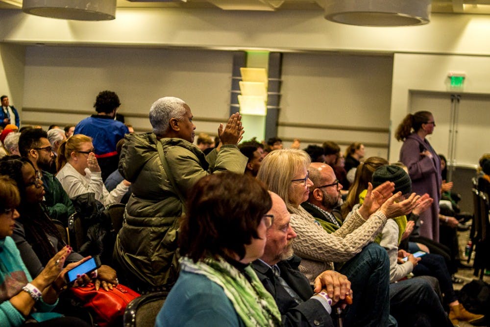  People clap during the town hall meeting on Feb. 1, 2018 at Kellogg Center. The town hall brought together students, staff and members of the MSU community to discuss the current climate of the campus. 
 
