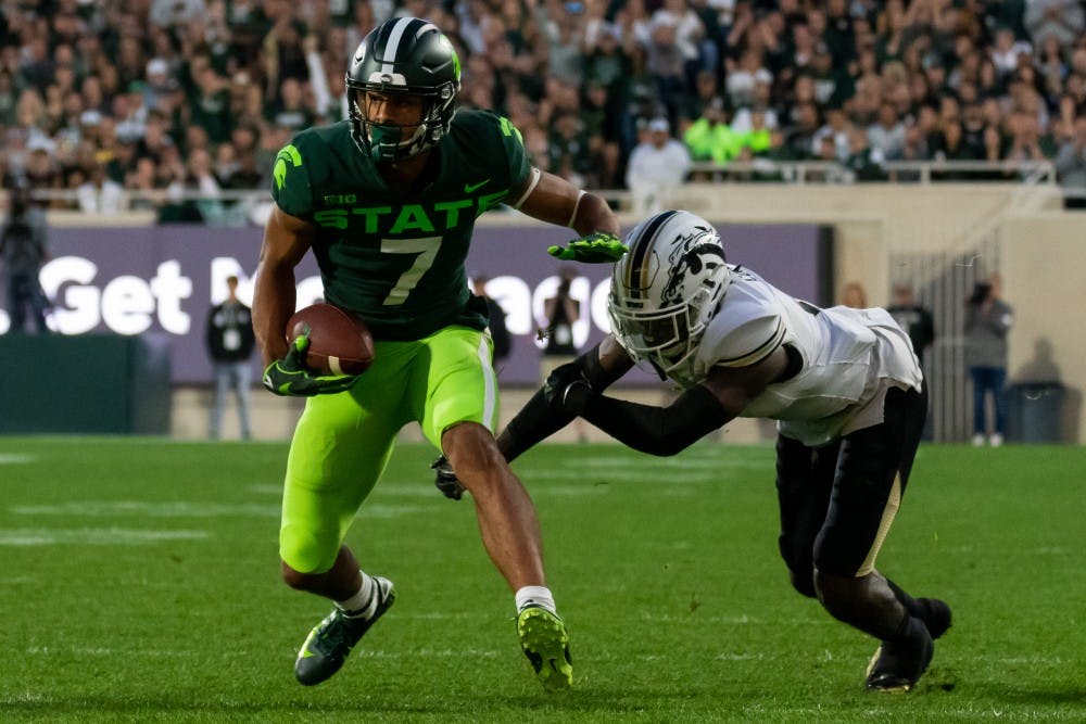 Senior wide receiver Cody White (7) brushes off a Western Michigan defender. The Spartans defeated the Broncos, 51-17, at Spartan Stadium on September 7, 2019. 
