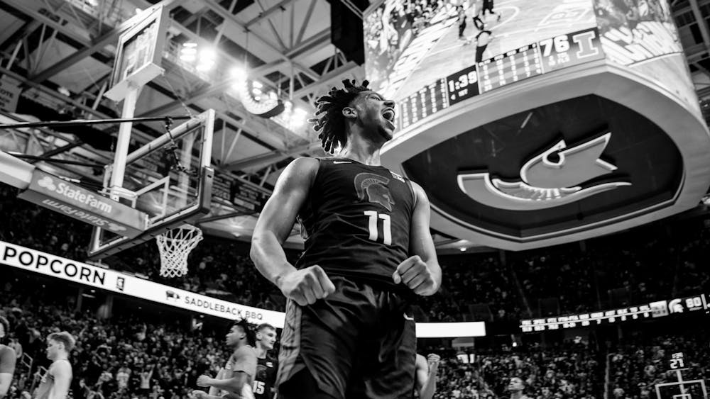 <p>Senior guard AJ Hoggard (11) erupts with energy after adding two more points to the scoreboard during an electric match against the University of Illinois at the Breslin Center on Feb. 10, 2024. Michigan State beat the University of Illinois 88-80.</p>