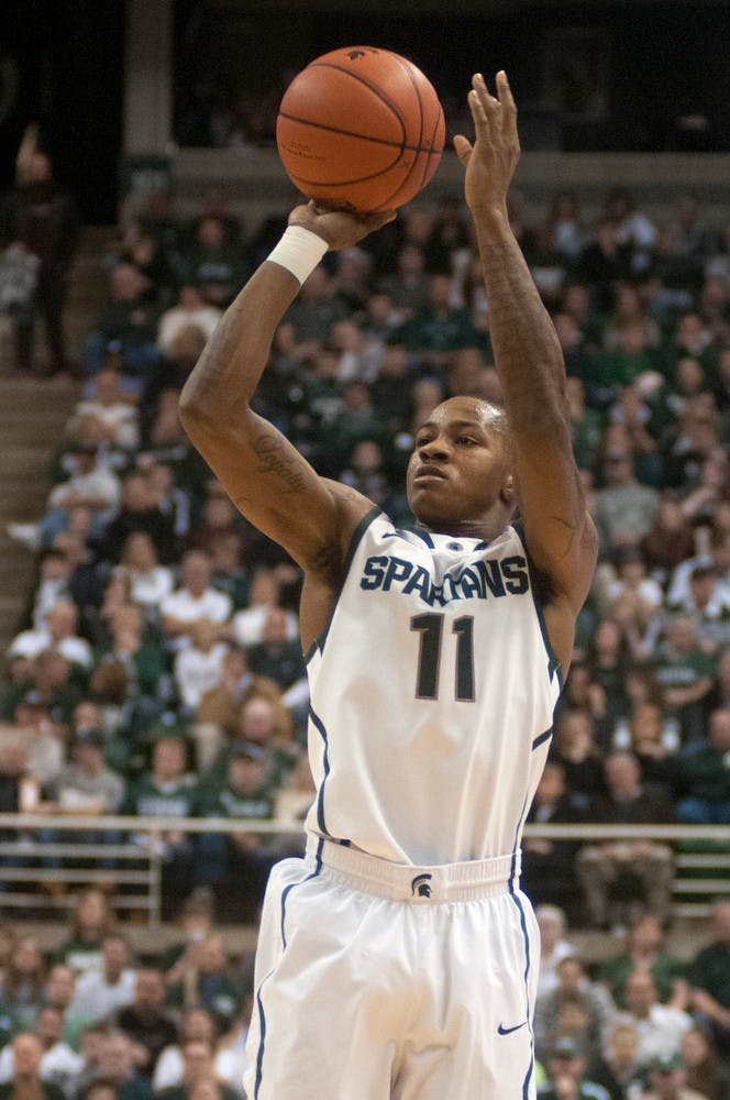 	<p>Senior guard Keith Appling shoots a three-pointer Dec. 28, 2013, at Breslin Center during the game against New Orleans. The Spartans defeated the Privateers, 101-48. Julia Nagy/The State News</p>