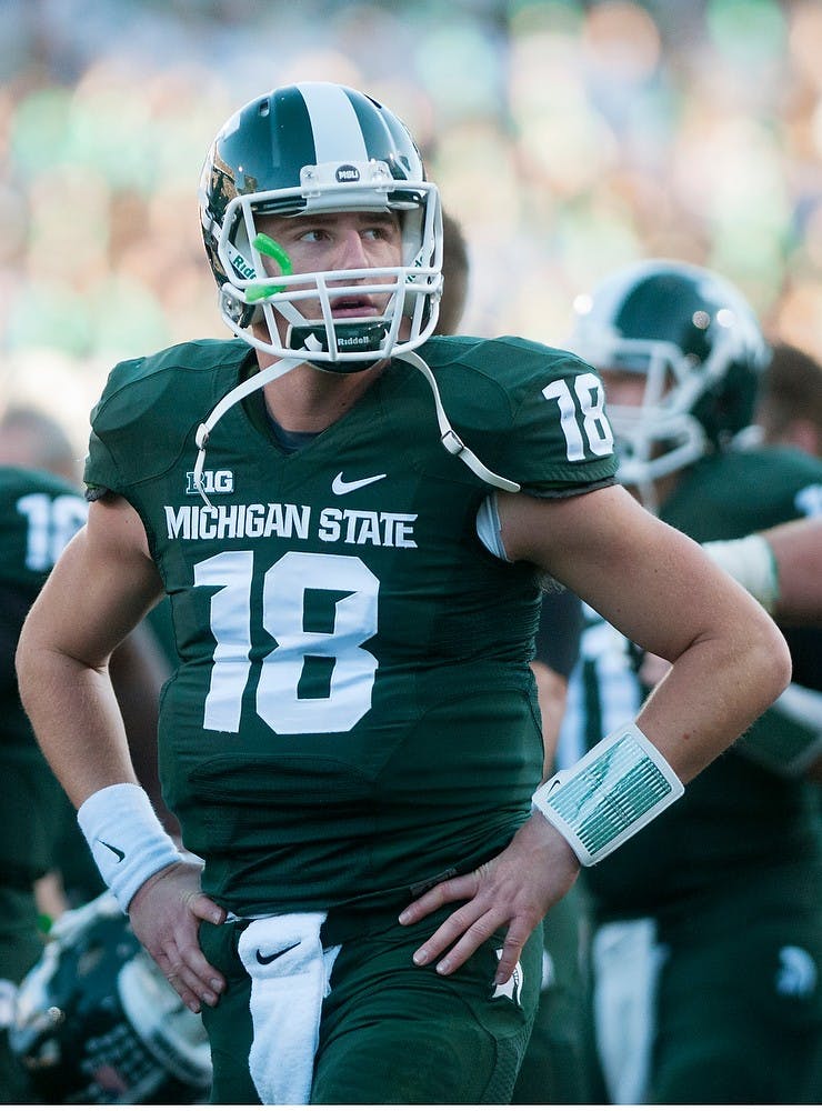 <p>Junior quarterback Connor Cook watches a play during the game against Michigan on Oct. 25, 2014, at Spartan Stadium. The Spartans defeated the Wolverines, 35-11. Jessalyn Tamez/The State News </p>
