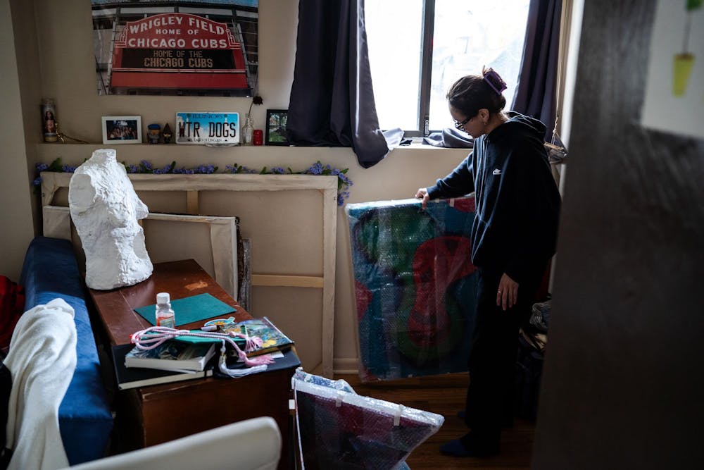 Fourth year Michigan State studio art student Evan Yalowitz explains the different pieces displayed in her room on April 13, 2025. Yalowitz says that, “I let a lot of emotion drive all my pieces, but I don’t see that as a weakness — I see that as my drive.”