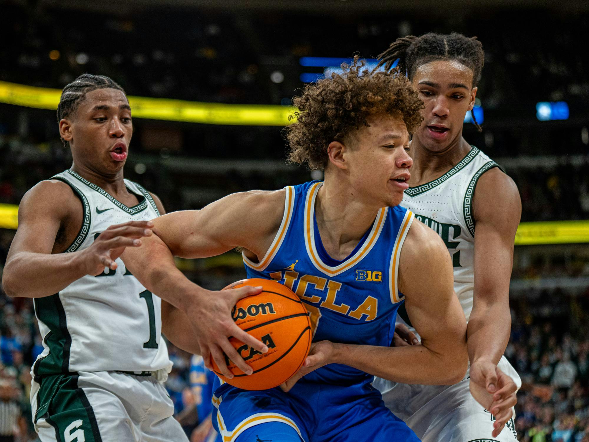 <p>UCLA sophomore guard Trent Perry (0) between Michigan State at the United Center in Chicago, Illinois on Friday, March 13, 2026.&nbsp;</p>