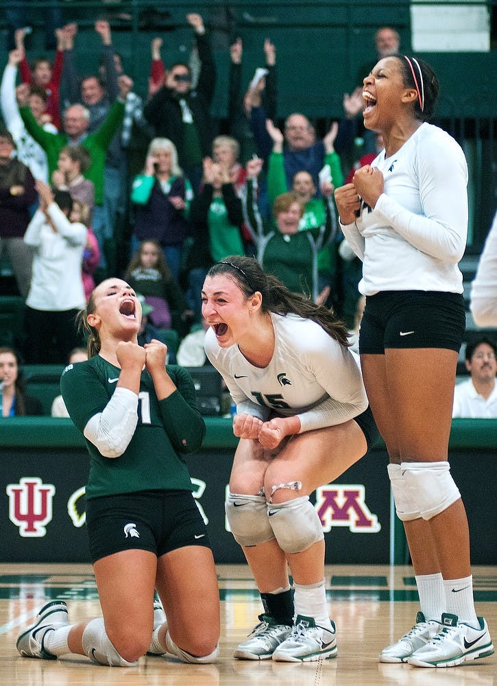 	<p>From left, sophomore libero Kori Moster, junior outside hitter Lauren Wicinski, and sophomore middle blocker and outside hitter Jazmine White celebrate after scoring the match winning point on Friday, Nov. 9, 2012, at Jenison Fieldhouse. <span class="caps">MSU</span> defeated Minnesota 3-1. James Ristau/The State News</p>