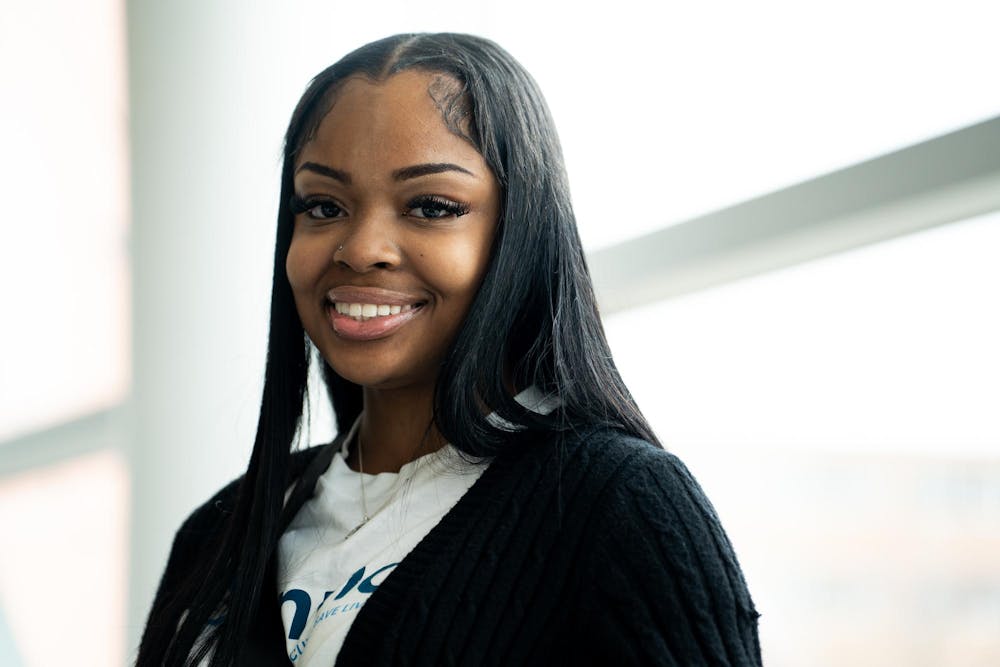 Mychaela Lovelace, a kinesiology senior, poses for a photo in Brody Square on April 12, 2024. Lovelace had her life saved by a bone marrow transplant 15 years ago and now volunteers with the National Marrow Donor Program.