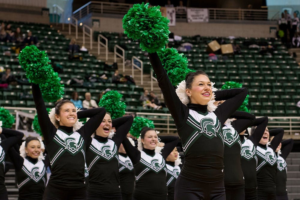 	<p>Dietetics senior Chelsea Amman competes with the <span class="caps">MSU</span> Pompon team in the Mid American Pompon State Championship on Feb. 8, 2014, at Breslin Center. Teams are judged based on the difficulty and execution of their routines. Michigan State took second place in the collegiate division.</p>