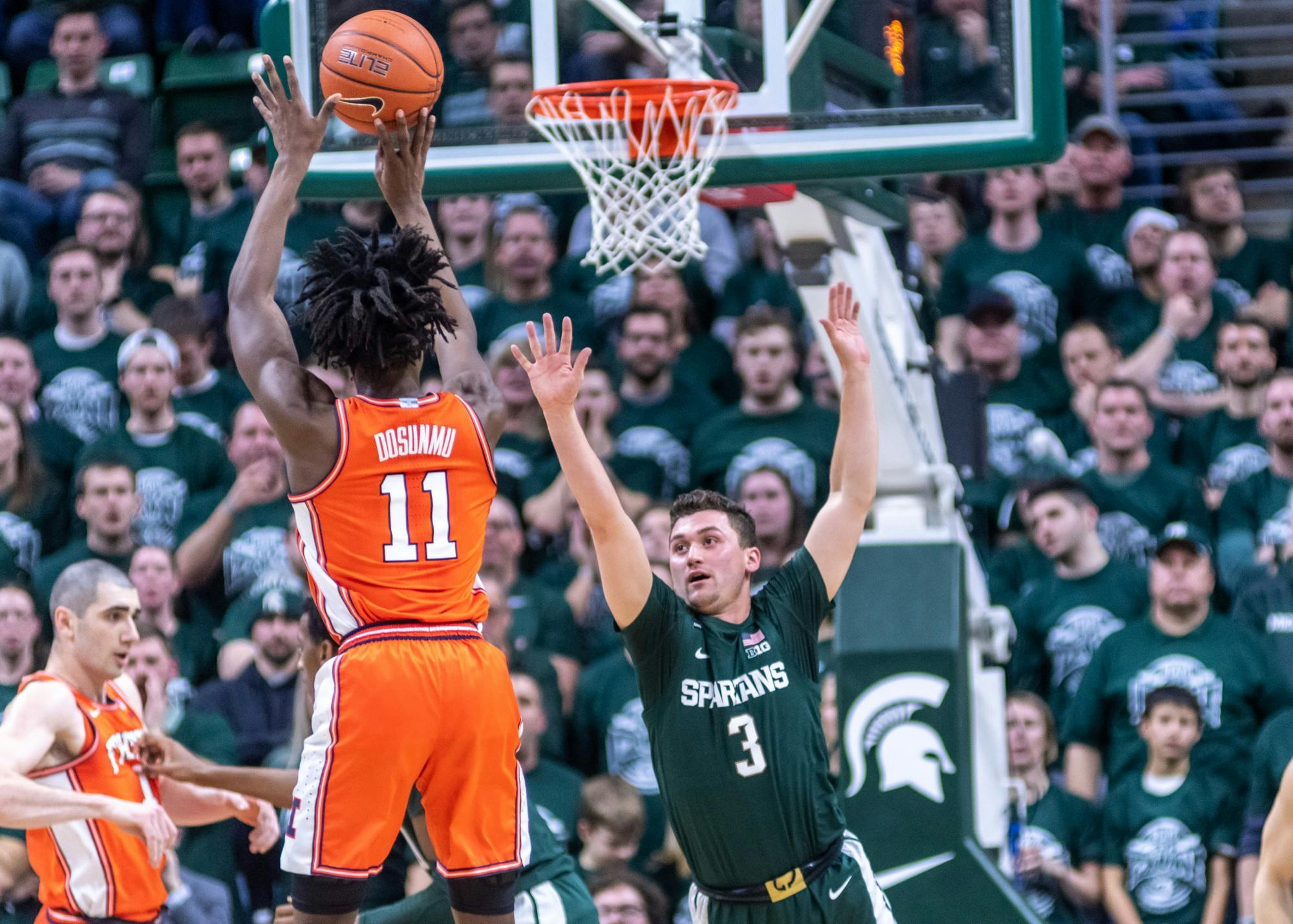 Illinois guard Ayo Dosunmu (11) shoots over sophomore guard Foster Loyer (3). The Spartans defeated the Illini, 76-56, at the Breslin Student Events Center on January 2, 2020.