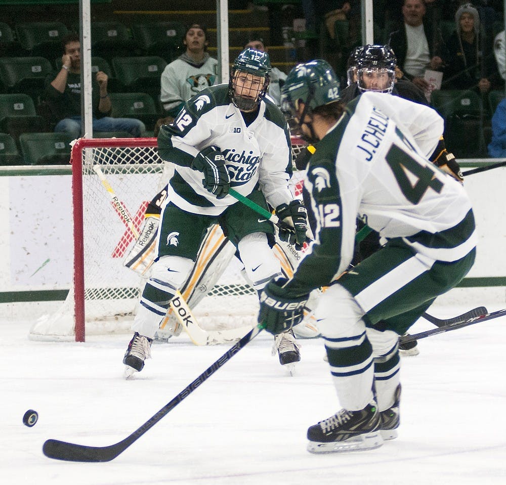 	<p>Sophomore forward Ryan Keller waits in front of the American International net for the puck Nov. 3, 2013, at Munn Ice Arena. The Spartans shutout the Yellow Jackets in the second game of the series, 4-0. Danyelle Morrow/The State News</p>