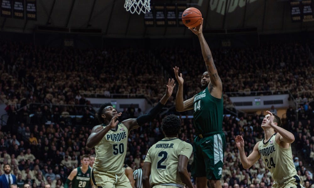 <p>Junior forward Nick Ward (44) goes up for a layup at Mackey Arena on Jan. 27, 2019. The Spartans fell to the Boilermakers, 73-63.</p>